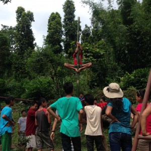One of our survivor challenges: climb an oiled bamboo pole!